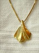 14k gold 
pendant.
with chain in 
sterling silver