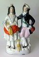 Staffordshire 
figure of two 
young people 
with ears of 
corn, 19th 
century. 
England. 
Polychrome ...