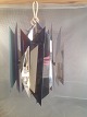 Simon 
Henningsen. 
Pendant (Tivoli 
lamp). 
Chrome plated 
and lacquered 
metal. 
Designed for 
the ...
