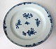 Plate in 
porcelain, 
China, c. 1780. 
Blue decorated 
with flowers 
and patterns, 
with brown 
edge. ...