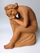 Danish artist 
(20th cent.): A 
seated nude 
woman. Clay. 
Stamped on the 
bottom: 
Lindelse. 
Denmark. ...