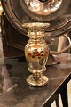 Vase in old 
mercery silver 
with flower 
decoration on 
the side.
Height: 
24.5cm.
