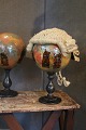 Antique French 
decorated glass 
ball 
on black 
wooden base. 
Originally 
used to put the 
wig on ...