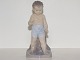 Royal 
Copenhagen Art 
Nouveau 
figurine, boy 
in swimming 
trunks.
Decoration 
number 1786.
The ...
