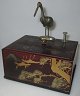 Japanese 
Cigaretbox 1920 
- 1930. 
Lacquered box 
with gilded 
decorations in 
the form of 
flying ...
