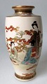 Satsuma vase, 
19th century. 
Earthenware. 
Decoration of 
kimono-clad 
women in a 
landscape. Top 
...