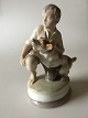 Royal 
Copenhagen 
Figurine of Boy 
with dog No 
2140. Measures 
16,5cm and is 
in good 
condition.