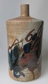 Danish artist 
(20th cent.): 
Floor vase. 
Stoneware with 
over glaze in 
brown, blue and 
black. H .: ...