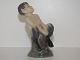 Royal 
Copenhagen 
figurine, faun 
on tree stump.
The factory 
mark tells, 
that this was 
made in ...