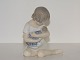 Royal 
Copenhagen 
figurine, girl 
with doll.
The factory 
mark tells, 
that this was 
made between 
...