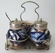 English Plet de 
menage, 1888. 
Silver-plated. 
Jars of 
earthenware 
with 
decorations and 
gilding. ...