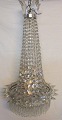 Large crystal 
chandelier, 
19th century. H 
.: 105 cm. Dia 
.: 51 cm. For 
five electric 
light. On ...