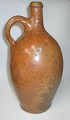 Snaps stone 
jar, pottery, 
glazed. 19th 
century. With 
handle. H .: 32 
cm.
