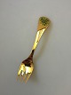 Georg Jensen 
Annual Fork 
1989 in gilded 
Sterling Silver 
with Enamel. 
Measures 14.5 
cm (5 45/64")