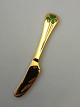 Georg Jensen 
Annual Knife 
1979 in gilded 
Sterling Silver 
with enamel. 
Measures 16 cm 
(6 19/64")