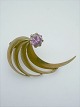 Brooch. Gold 8k 
hshs with 
amethyst. 
Contact for 
price