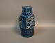 Ceramic vase 
with blue glaze 
and motif on 
the sides by 
Michael 
Andersen and 
son, no. 6134.
H: ...