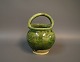 Ceramic with 
green glaze by 
an unknown 
ceramics 
artist.
H: 15,5 cm and 
W: 10 cm.