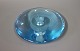 Holmegaard 
candlestick in 
light blue. 
H: 2 cm and 
Dia: 15 cm.