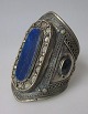 Afghanistan, arm jewelry, 20th century. Silver plated metal with decorations and lapis lazuli. H ...