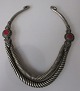 Afghan neck ring, 20th century. Silver-plated metal. With decorations and red stone. L .: 20 cm. ...