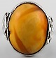 Silver ring 
with amber.
Size: 18.5 mm.
Not stamped.
In very good 
condition.