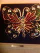 Brooch. 
Butterflies 
with enamel and 
rhinestones 
crystals. Gold 
plated metal.