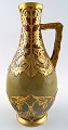French, 
Sarreguemines 
Art Nouveau 
pitcher in 
ceramics, app. 
1910.
Beautiful 
glaze with gold 
...