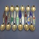 Danish Krone 
Silver, set of 
12 Christmas 
spoons of gilt 
sterling silver 
and enamel. 
1967 - 1978.