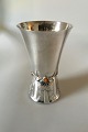 Georg Jensen 
Silver Vase 
with Amber 
Stones No 116. 
The vase is 
ornamented with 
a leaf motif 
and ...