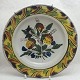 Kellinghusen 
faience deep 
plate decorated 
in colours with 
strawberry 
plants. Denmark 
1763 - ...