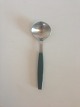 Georg Jensen 
Stainless Green 
Strata Bouillon 
Spoon. Measures 
15.7 cm / 6 
3/16 in.