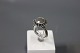 Pandora twisted ring in oxyd 925 sterling silver with large "Morgensten".
5000m2 showroom.