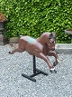 Carousel horse painted wooden plinth of metal appears with rejections and shrinkage cracks ...