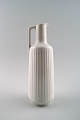 German jug in 
white 
porcelain, 
modern design, 
fluted.
In perfect 
condition.
Measures: 22.5 
...