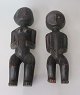 Par African carved wooden figures, 20th century. A woman and a child. Eyes with beads. H .: ...