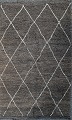 A handknotted Beni Ouarain Maroccan tribal rug, made of natural colored light gray wool with ...