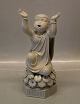 Royal 
Copenhagen 
12458 RC Child 
arms raised on 
a stand with 
Lotus Flowers 
23.5 cm Young 
Buddha? ...