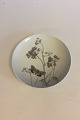 Royal 
Copenhagen 
Motif Plate 
with Flowers 
and a Moth No 
1808/1125.
Measures 25cm 
/ 10".