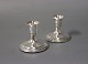 A pair of low 
candlesticks in 
830 silver with 
felt at the 
bottom. 
The 
candlesticks 
are in ...