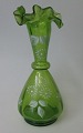 Bohemian vase 
in green glass 
with white 
enamel 
decorations, 
19th century. H 
.: 15 cm.