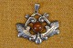Pendant Art 
Nouveau in 
silver with a 
pearl of amber 
in the center. 
Stamped 830 S. 
Art No. 3