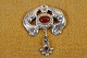 Broche Art 
Nouveau in 
organic pattern 
pearl of brown 
agate in the 
center of the 
brooch and of 
...