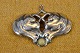 Brooch Art 
Nouveau in 
organic pattern 
and small pearl 
of amber. 
Stamped 2 
towers = 
Copenhagen ...