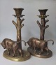 Pair of bronze candlesticks, Denmark, app. 1930. Decorated with bulls on oval base near a tree ...