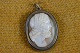 Cameo Etruscan 
gentleman head 
cut in conch 
shell mounted 
in silver frame 
surrounded by 
twisted ...