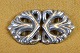 Belt buckle in 
silver with 
organic Jugend 
decoration. 
Stamped 830 S. 
Size:10*5,5cm. 
Art No. 44