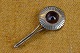 Brooch in 
silver shaped 
like a Marigold 
with amethyst 
center. 
Unstamped but 
is undoubtedly 
of ...