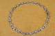 Collier 
necklace 
articulated in 
ovals attached 
silver flowers, 
assembled with 
double joints. 
...