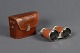 Binoculars with 
leather case, 
l: 8 cm